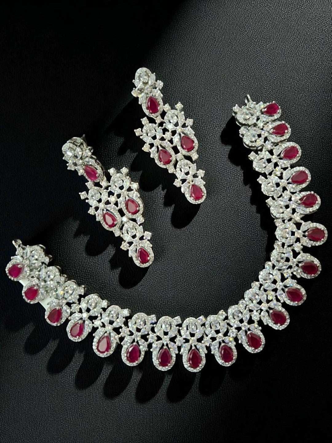 ruby necklace set, red stone jewellery, bridal jewellery, American diamond set, wedding choker set, traditional necklace, ethnic jewellery, diamond look jewellery, festive necklace and earrings, silver finish jewellery