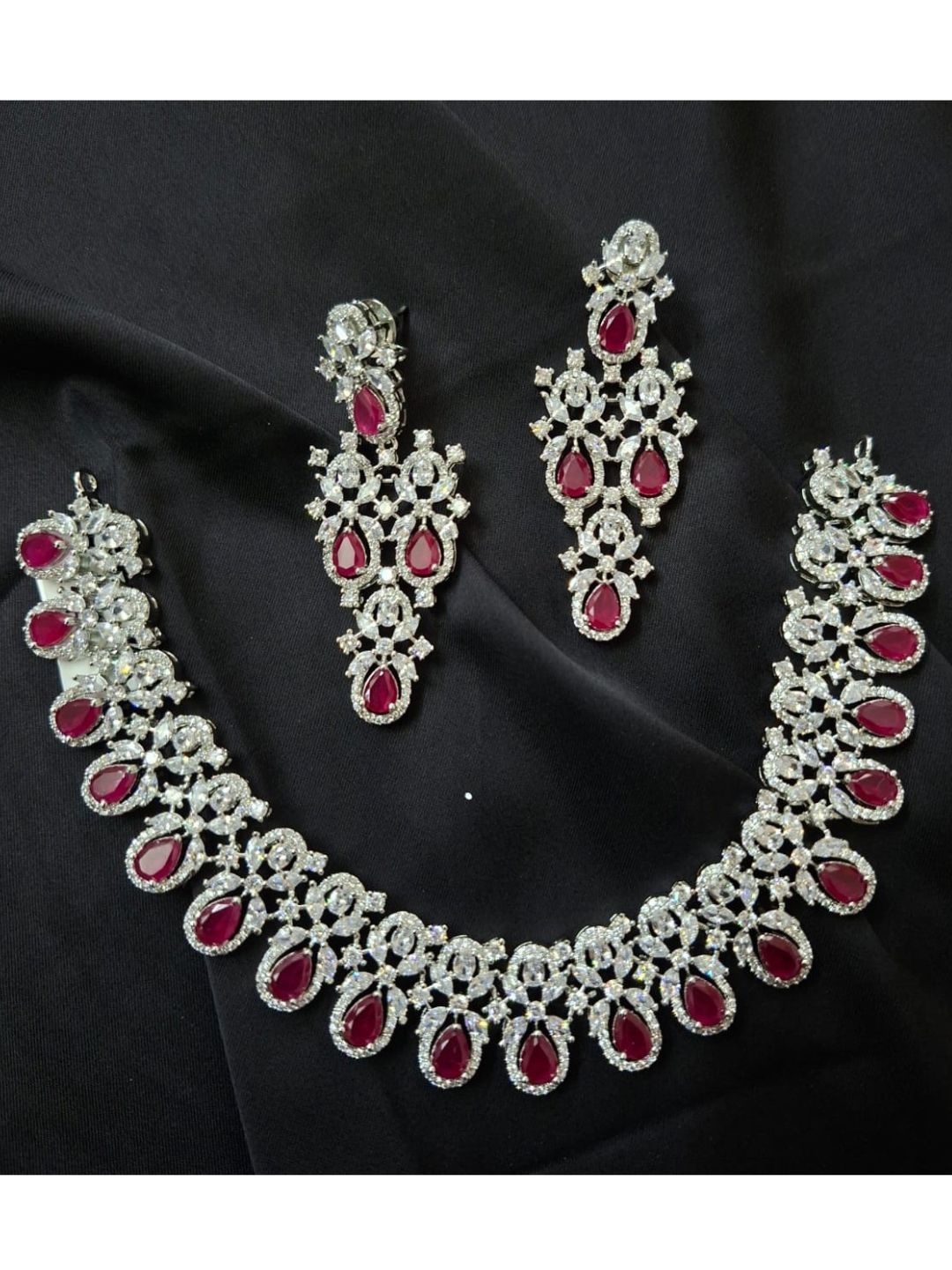ruby necklace set, red stone jewellery, bridal jewellery, American diamond set, wedding choker set, traditional necklace, ethnic jewellery, diamond look jewellery, festive necklace and earrings, silver finish jewellery