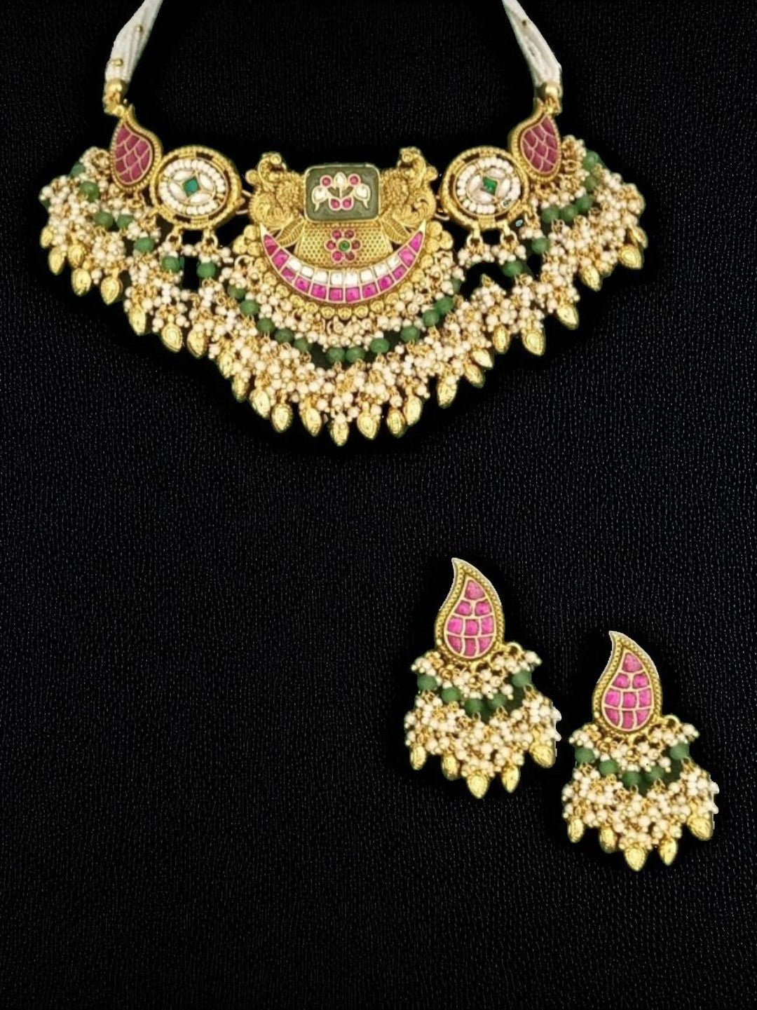 bridal jewellery, wedding choker, sangeet, traditional bride, festive, ethnic wear, celebration, pooja, occasion wear, navratri, diwali look, cultural jewellery, heritage, temple design, handcrafted, artisanal, antique finish, karigari, detailed work, timeless design, statement piece, choker set, jhumka earrings, fashion jewellery, ethnic fashion, layered necklace, bold look, luxury style, kundan, beads, gold polish, pearlwork, meena work, danglers, multi-strand choker, jadau inspired, modern traditional,