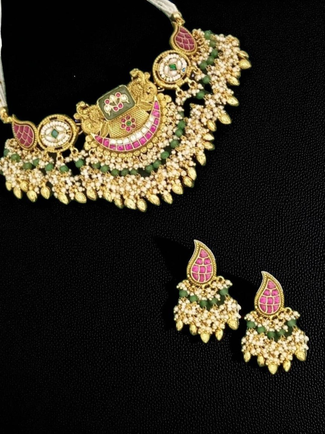 bridal jewellery, wedding choker, sangeet, traditional bride, festive, ethnic wear, celebration, pooja, occasion wear, navratri, diwali look, cultural jewellery, heritage, temple design, handcrafted, artisanal, antique finish, karigari, detailed work, timeless design, statement piece, choker set, jhumka earrings, fashion jewellery, ethnic fashion, layered necklace, bold look, luxury style, kundan, beads, gold polish, pearlwork, meena work, danglers, multi-strand choker, jadau inspired, modern traditional,
