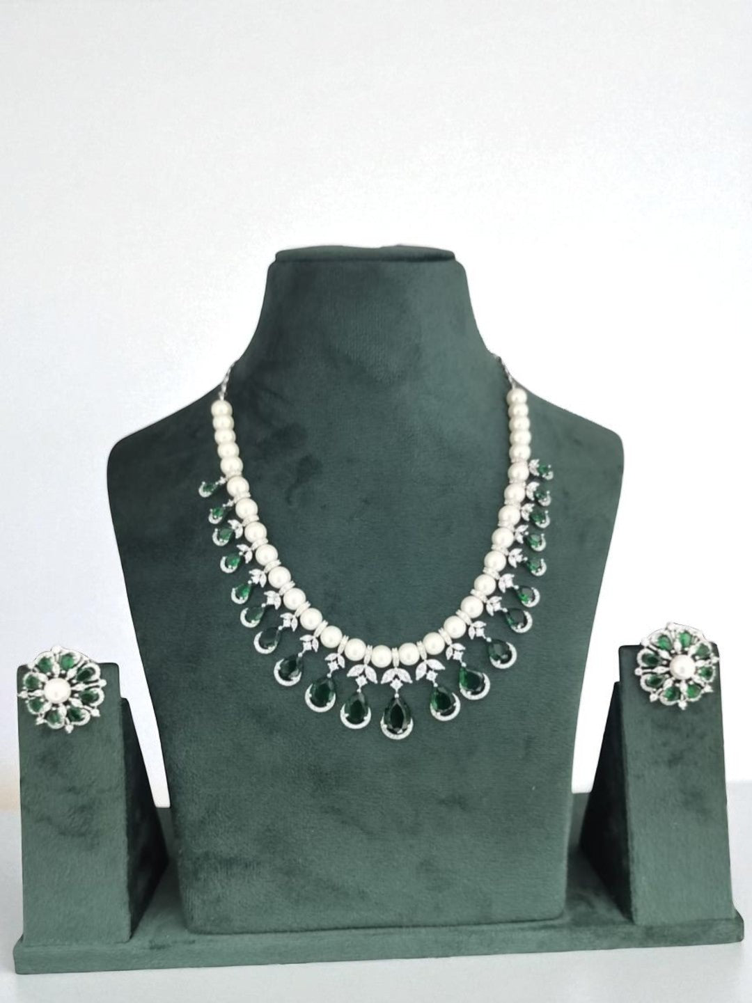 green and white jewellery, pearl necklace set, emerald drop jewellery, silver finish necklace, bridesmaid jewellery, lightweight festive jewellery, floral earrings set, pearl emerald jewellery, minimalist ethnic jewellery, modern indian jewellery