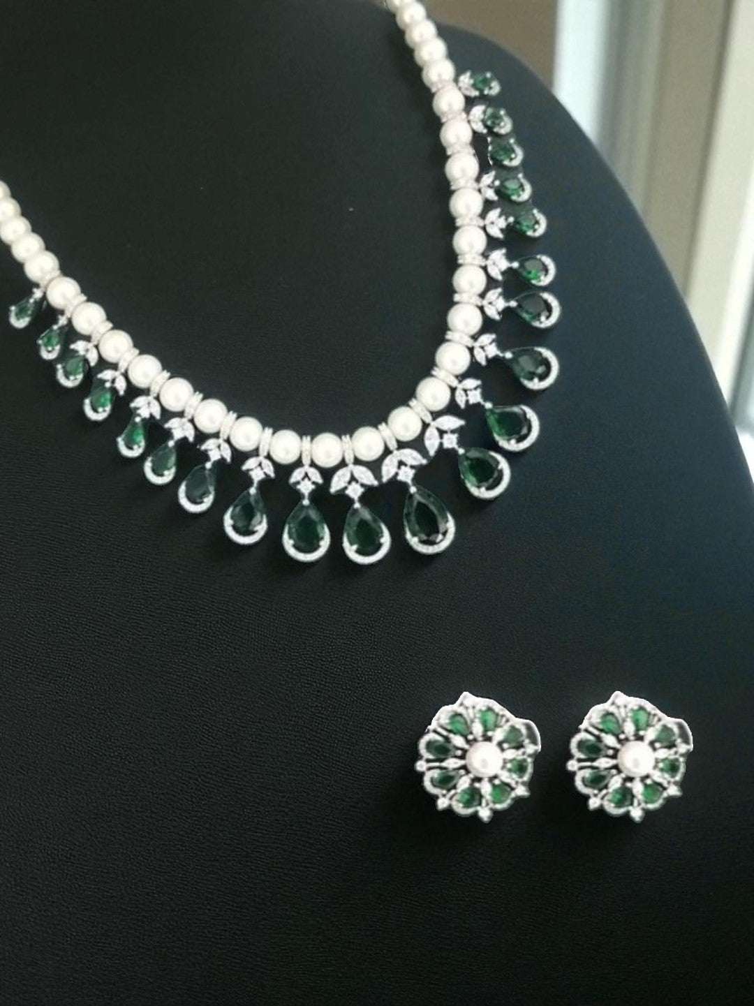 green and white jewellery, pearl necklace set, emerald drop jewellery, silver finish necklace, bridesmaid jewellery, lightweight festive jewellery, floral earrings set, pearl emerald jewellery, minimalist ethnic jewellery, modern indian jewellery