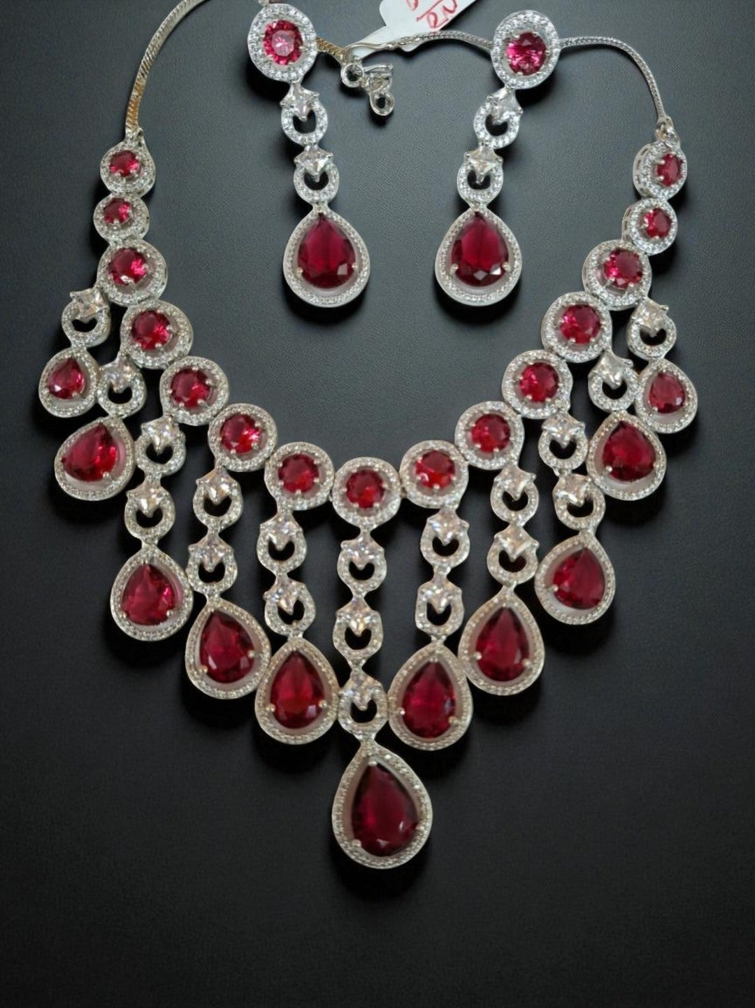 ruby necklace set, statement jewellery, bridal necklace, american diamond jewellery, red stone jewellery, house of pranvi, party wear jewellery, teardrop necklace, festive necklace set, engagement set, luxury indian jewellery, chandelier necklace, wedding guest jewellery, designer red jewellery