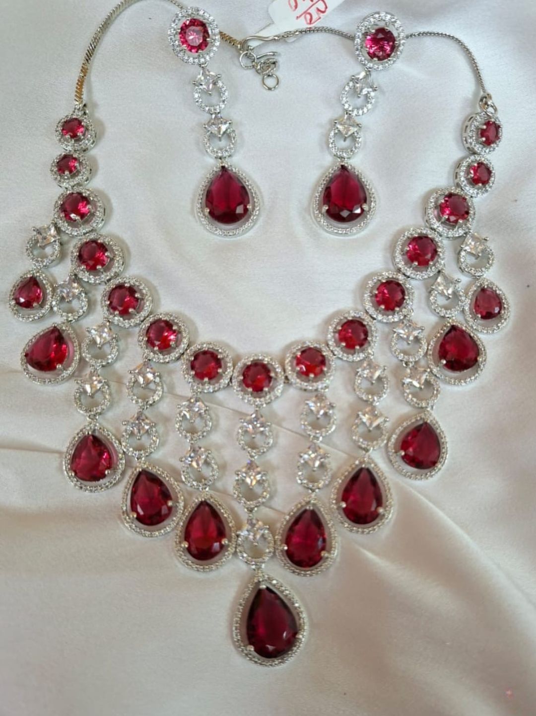 ruby necklace set, statement jewellery, bridal necklace, american diamond jewellery, red stone jewellery, house of pranvi, party wear jewellery, teardrop necklace, festive necklace set, engagement set, luxury indian jewellery, chandelier necklace, wedding guest jewellery, designer red jewellery