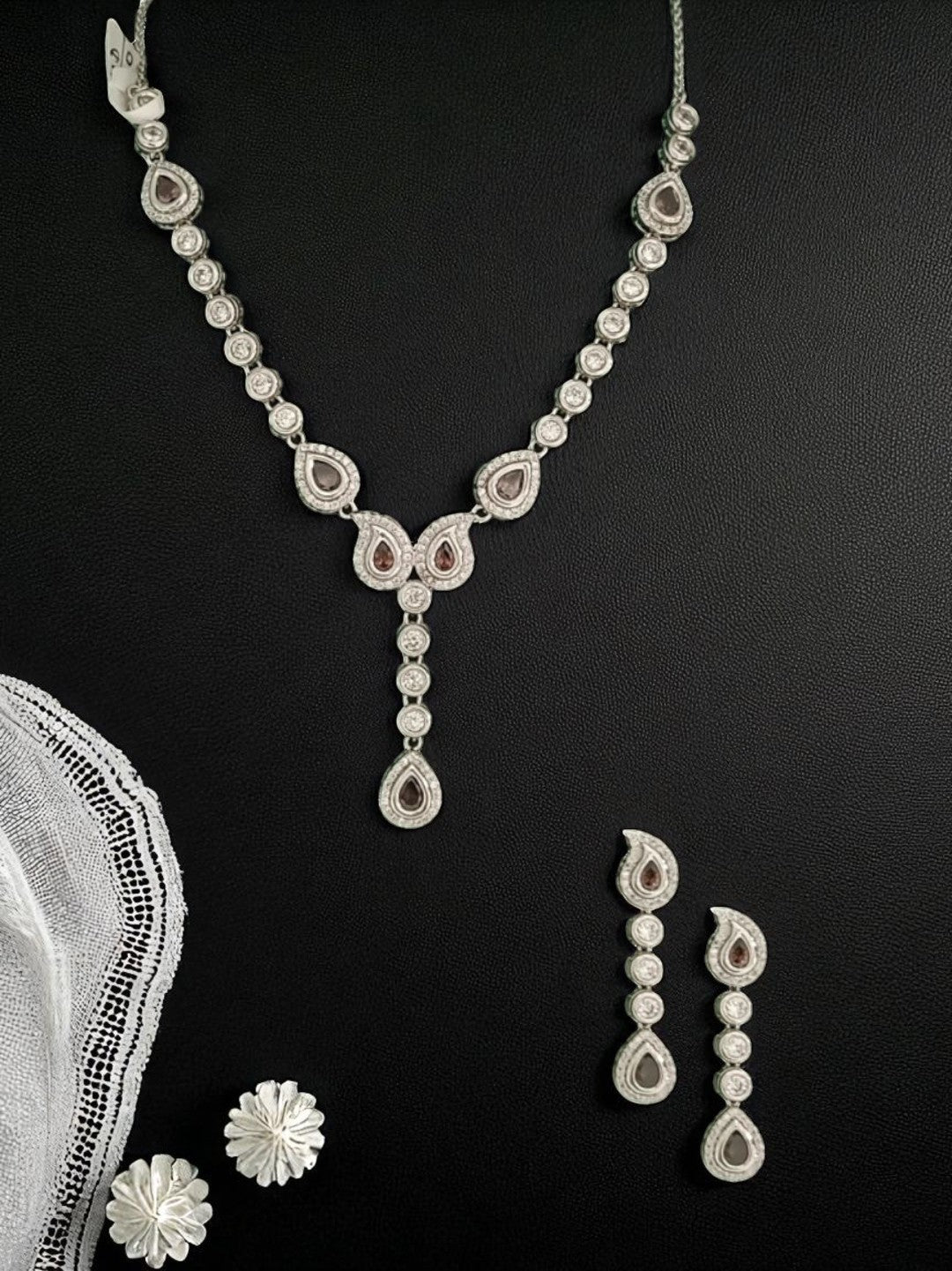 diamond finish necklace
party wear necklace set
silver necklace for women
teardrop diamond necklace
elegant jewellery for weddings
luxury necklace set for women
house of pranvi jewellery
minimalist diamond necklace
statement necklace for parties
bridal necklace set