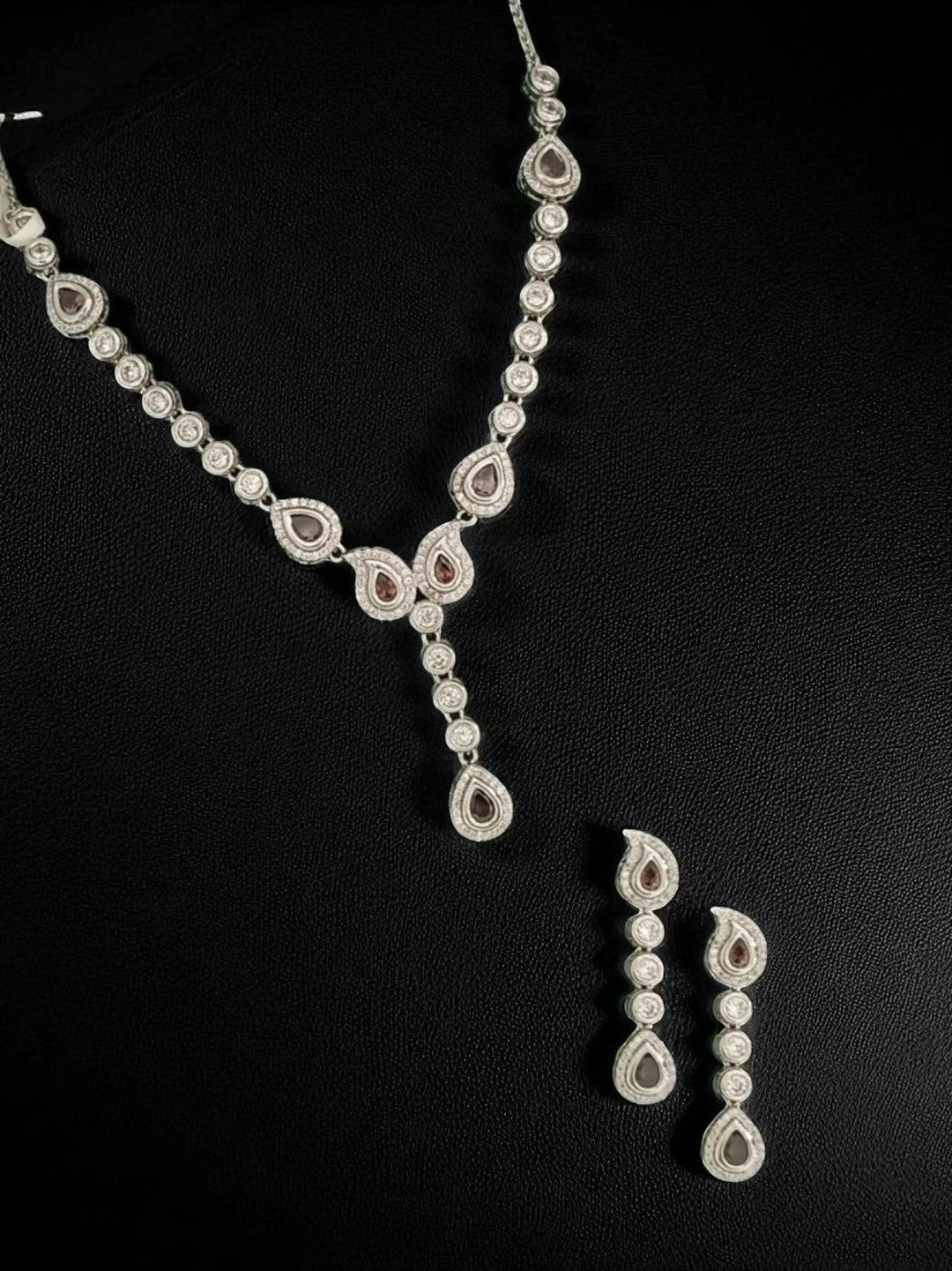 diamond finish necklace
party wear necklace set
silver necklace for women
teardrop diamond necklace
elegant jewellery for weddings
luxury necklace set for women
house of pranvi jewellery
minimalist diamond necklace
statement necklace for parties
bridal necklace set