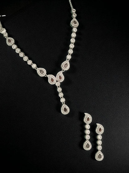 diamond finish necklace
party wear necklace set
silver necklace for women
teardrop diamond necklace
elegant jewellery for weddings
luxury necklace set for women
house of pranvi jewellery
minimalist diamond necklace
statement necklace for parties
bridal necklace set