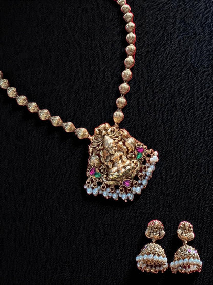antique gold, devotion-inspired, traditional necklace, temple jewellery, goddess pendant, festive style, bridal collection, royal jewellery