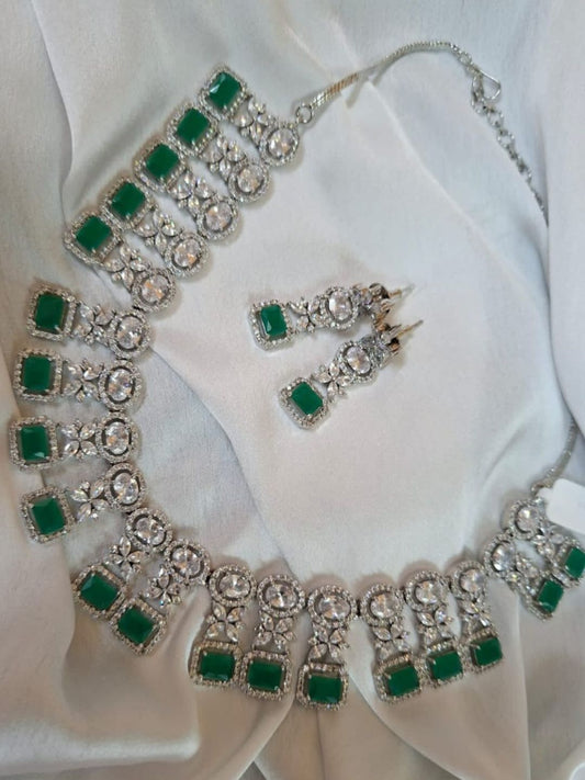 green stone jewellery, emerald necklace set, square cut necklace, traditional jewellery, bridal necklace set, American diamond jewellery, silver finish necklace, ethnic jewellery set, wedding jewellery, designer necklace and earrings