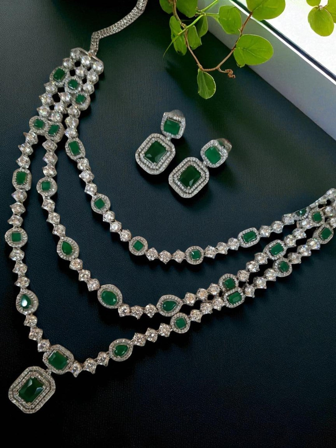 emerald layered necklace, triple strand jewellery set, green stone choker, diamond look jewellery, wedding jewellery, festive necklace set, silver finish jewellery, statement necklace, ethnic necklace set, traditional bridal jewellery