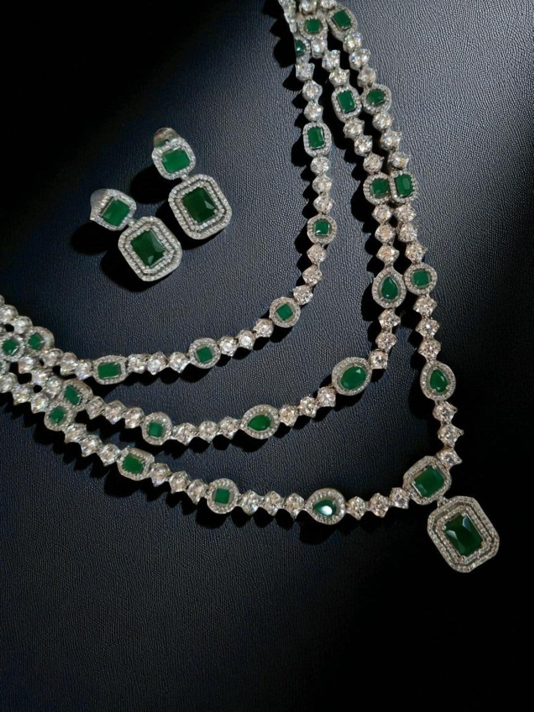 emerald layered necklace, triple strand jewellery set, green stone choker, diamond look jewellery, wedding jewellery, festive necklace set, silver finish jewellery, statement necklace, ethnic necklace set, traditional bridal jewellery