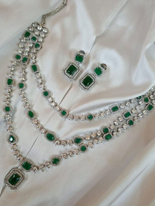 emerald layered necklace, triple strand jewellery set, green stone choker, diamond look jewellery, wedding jewellery, festive necklace set, silver finish jewellery, statement necklace, ethnic necklace set, traditional bridal jewellery