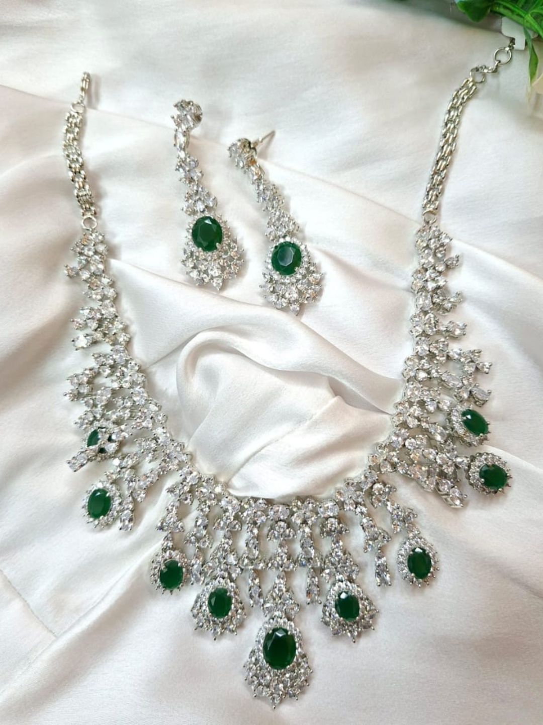 green stone necklace, emerald jewellery set, bridal choker set, diamond look jewellery, silver polish necklace, ethnic jewellery set, wedding jewellery, statement necklace, festive wear jewellery, American diamond set