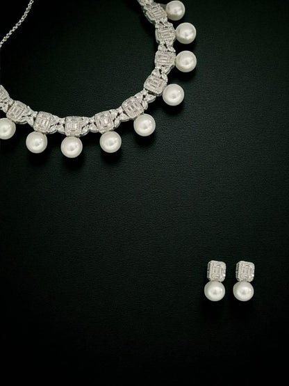 statement pearl necklace, luxury pearl jewellary, bridal diamond look set, white drop pearl necklace, evening jewellary, festive wear accessories, House of Pranvi jewellary, pearl and stone necklace, regal jewellary design, diamond textured choke