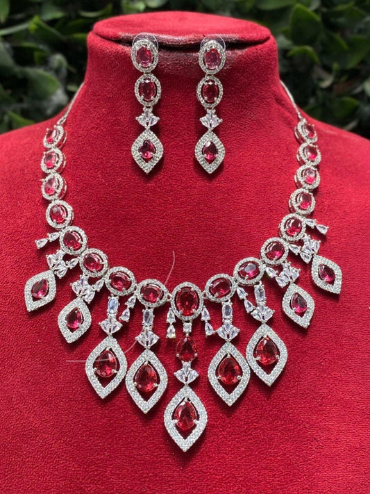 statement necklace, red stone jewellery, bridal set, luxury jewellery, modern ethnic, cocktail necklace, handcrafted jewellery, designer earrings, ruby look necklace, diamond finish jewellery