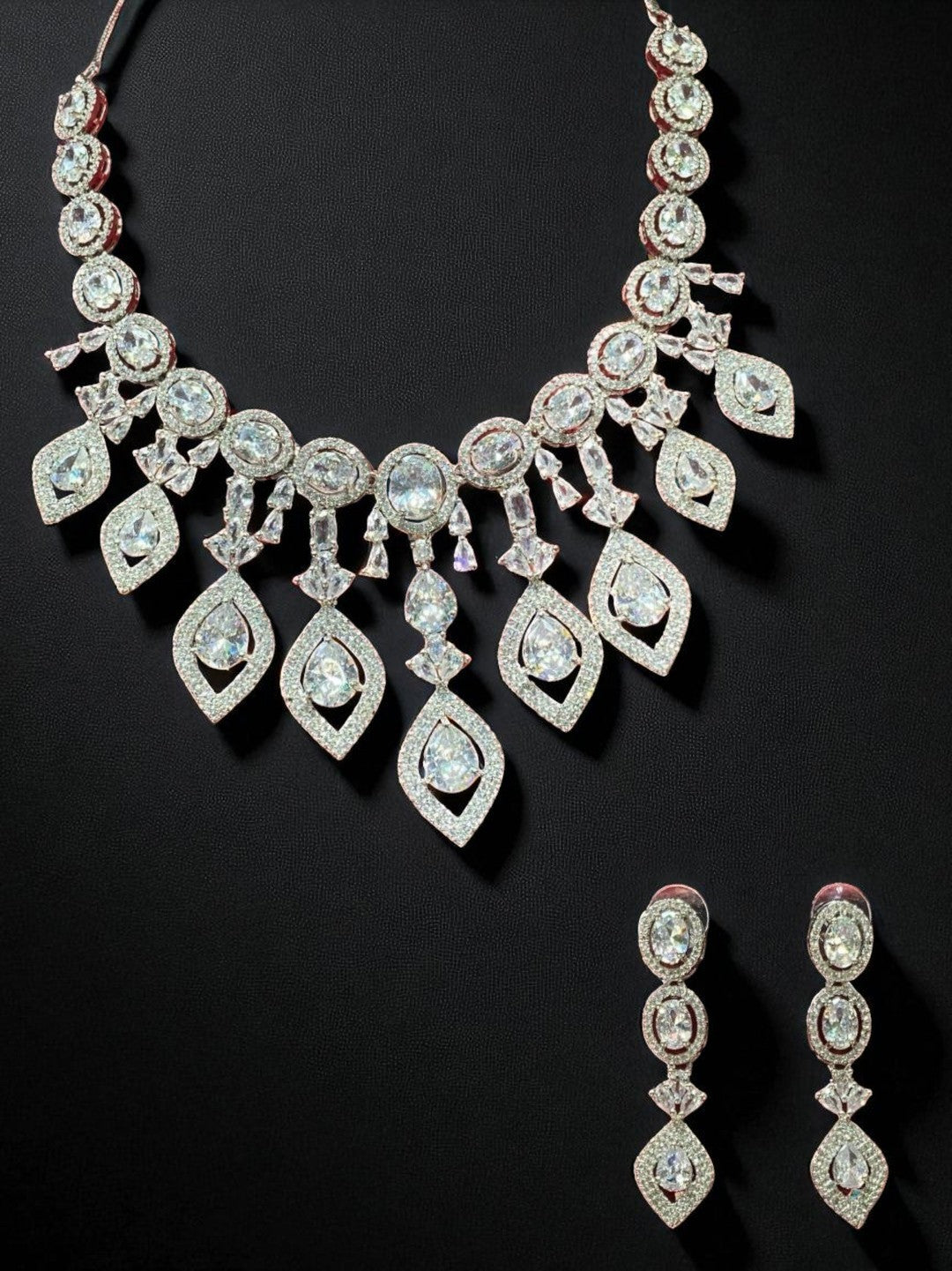  bridal set, luxury jewellery, modern ethnic, cocktail necklace, handcrafted jewellery, designer earrings, ruby look necklace, diamond finish jewellery