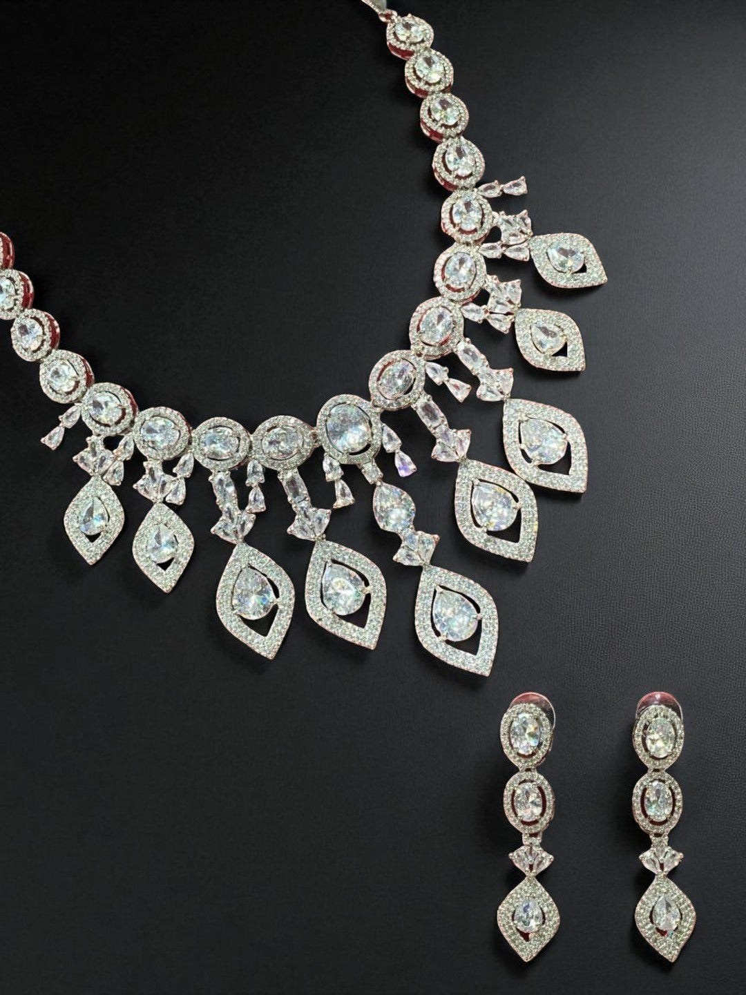  bridal set, luxury jewellery, modern ethnic, cocktail necklace, handcrafted jewellery, designer earrings, ruby look necklace, diamond finish jewellery