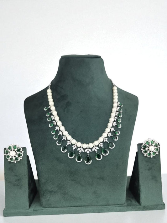 green and white jewellery, pearl necklace set, emerald drop jewellery, silver finish necklace, bridesmaid jewellery, lightweight festive jewellery, floral earrings set, pearl emerald jewellery, minimalist ethnic jewellery, modern indian jewellery

