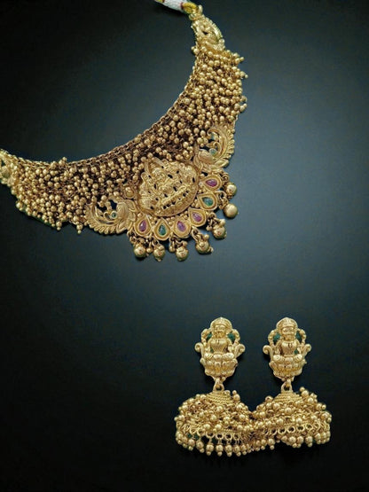 antique lakshmi necklace
temple jewellery necklace set
goddess lakshmi bridal jewellery
south indian gold tone necklace
traditional temple jewellery
handcrafted necklace for wedding
ethnic bridal necklace set
house of pranvi jewellery
lakshmi motif necklace set
festive jewellery for women