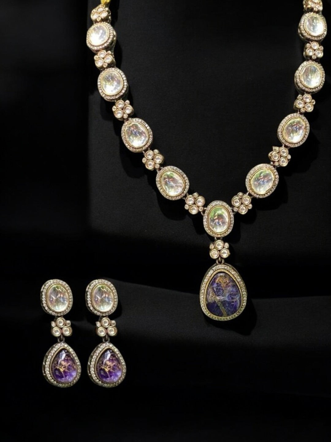 amethyst kundan necklace, violet stone necklace set, floral kundan jewelry, heritage kundan collection, indian wedding jewelry, house of pranvi designer set, kundan pendant necklace, handcrafted bridal set, traditional stone drop earrings, luxury indian fashion jewelry, gemstone kundan necklace, statement ethnic necklace, sangeet jewelry set, violet kundan drop earrings