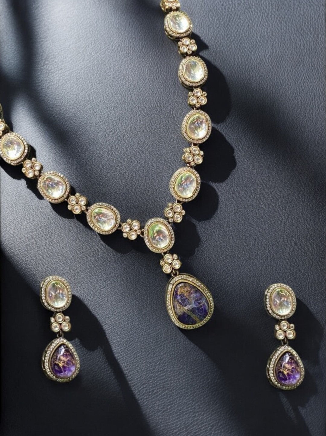 amethyst kundan necklace, violet stone necklace set, floral kundan jewelry, heritage kundan collection, indian wedding jewelry, house of pranvi designer set, kundan pendant necklace, handcrafted bridal set, traditional stone drop earrings, luxury indian fashion jewelry, gemstone kundan necklace, statement ethnic necklace, sangeet jewelry set, violet kundan drop earrings