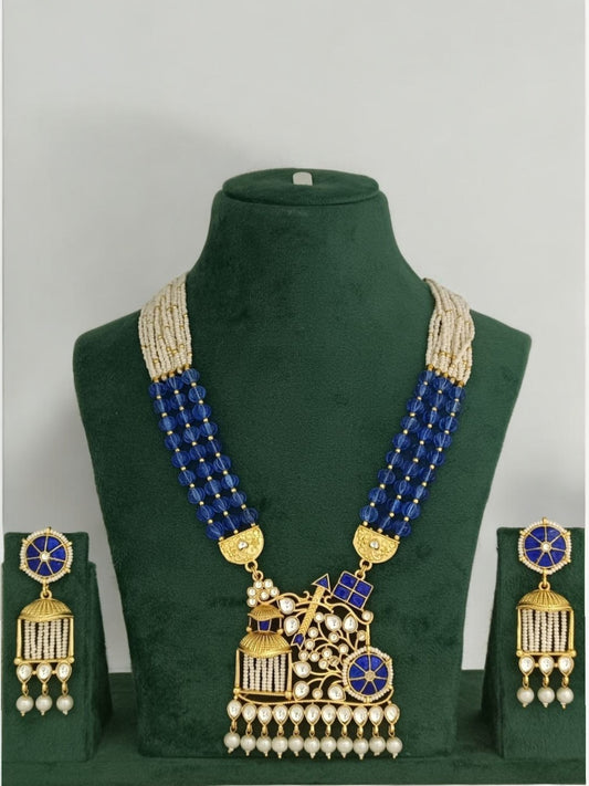 royal blue kundan necklace, chariot pendant necklace, Indian statement jewelry, handcrafted designer jewelry, kundan pearl jewelry set, traditional rath jewelry, bold ethnic necklace set, House of Pranvi jewelry, wedding statement jewelry, heritage Indian accessories, blue bead necklace, festive kundan set, regal Indian necklace, bridal jewelry India, temple inspired jewelry

