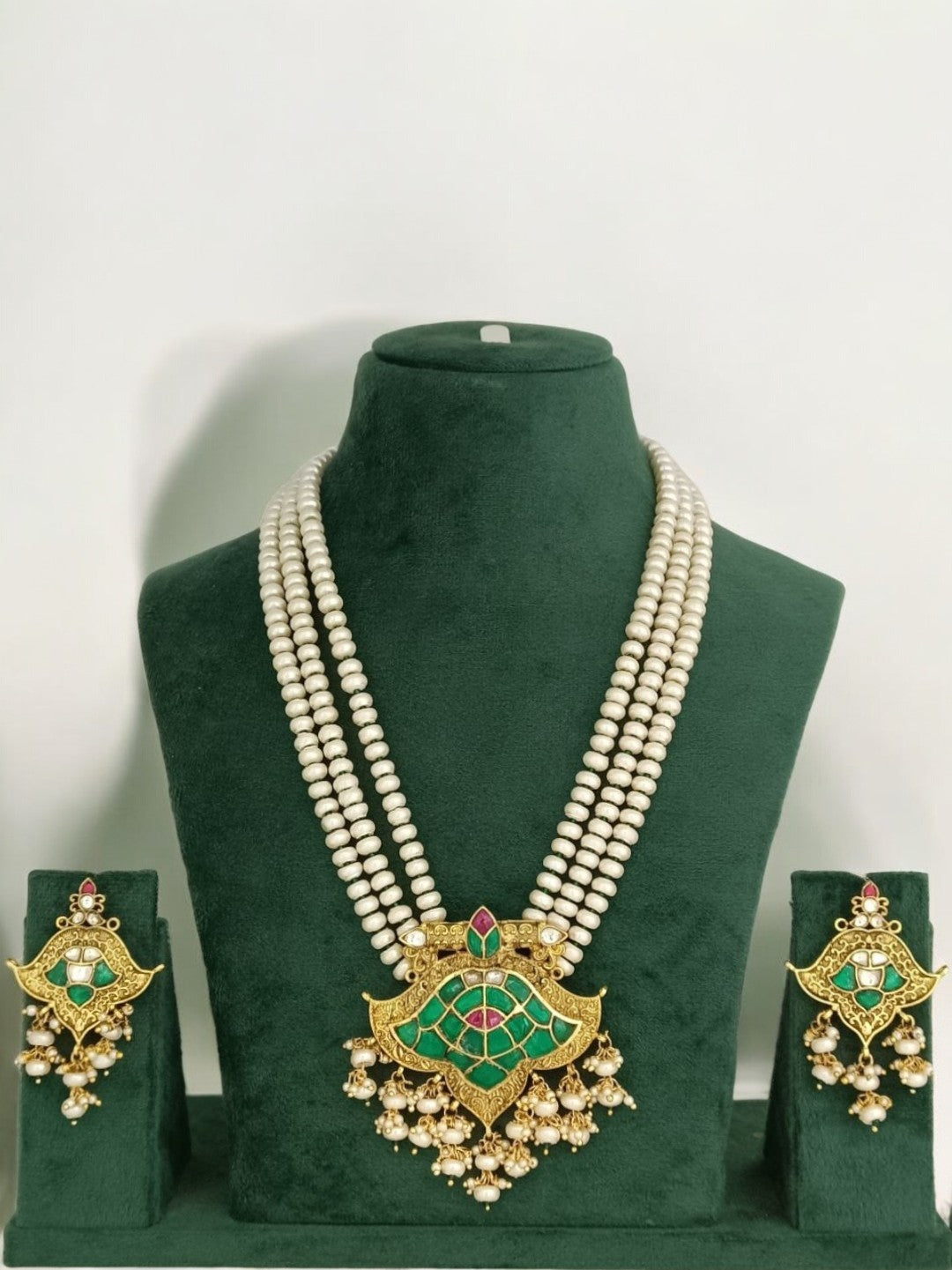 lotus kundan necklace, pearl ethnic jewelry, South Indian bridal set, green and pink kundan, traditional festive necklace, handcrafted Indian jewelry, House of Pranvi, statement kundan pearls, wedding jewelry set, heritage temple jewelry, regal pendant necklace, ethnic pearl choker, antique gold jewelry set, kundan necklace with earrings, festive Indian accessories