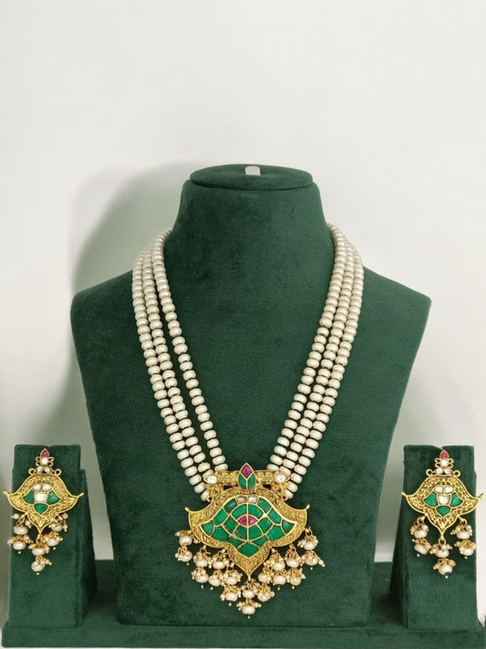 lotus kundan necklace, pearl ethnic jewelry, South Indian bridal set, green and pink kundan, traditional festive necklace, handcrafted Indian jewelry, House of Pranvi, statement kundan pearls, wedding jewelry set, heritage temple jewelry, regal pendant necklace, ethnic pearl choker, antique gold jewelry set, kundan necklace with earrings, festive Indian accessories