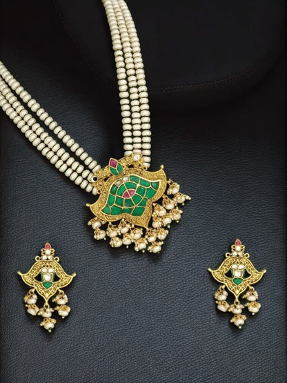lotus kundan necklace, pearl ethnic jewelry, South Indian bridal set, green and pink kundan, traditional festive necklace, handcrafted Indian jewelry, House of Pranvi, statement kundan pearls, wedding jewelry set, heritage temple jewelry, regal pendant necklace, ethnic pearl choker, antique gold jewelry set, kundan necklace with earrings, festive Indian accessories