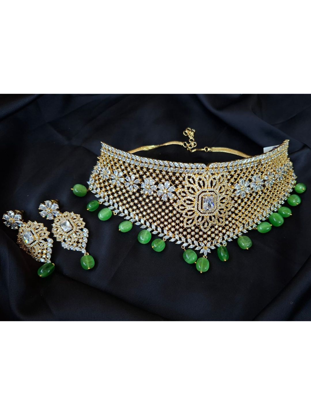green choker set, golden mesh jewellery, jade drop necklace, bridal kundan jewellery, statement gold choker, diamond look choker, ethnic jewellery set, sangeet jewellery, cocktail wedding set, green stone earrings, luxurious bridal jewellery