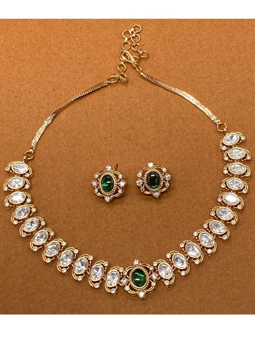 minimal festive jewellery, sleek choker set, green centre necklace, modern ethnic jewellery, cocktail jewellery, polki with pearl detailing, handcrafted necklace, elegant festive set, dainty bridal look